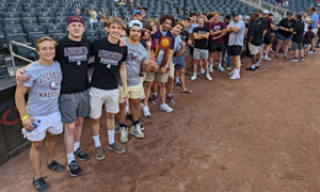 Augsburg men's wrestling, 2023 Division III Champions, at a Minnesota Twins game (Courtesy photo)